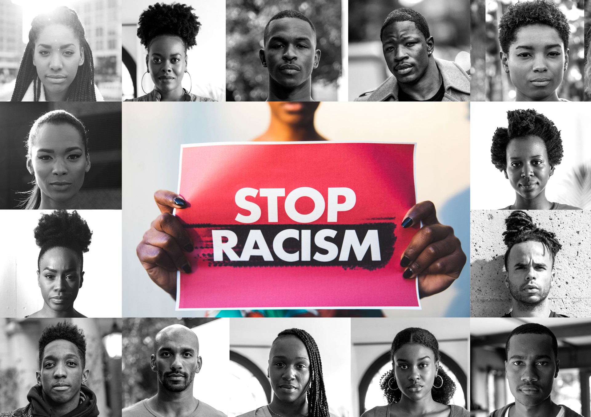 Woman holding a red sign against racism and a mix of afro american men and women faces